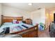 Bedroom with wood framed bed, dresser and closet at 7029 Oakwood Dr, New Port Richey, FL 34652