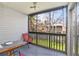 Screened porch with outdoor seating and backyard view at 7029 Oakwood Dr, New Port Richey, FL 34652