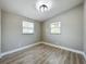 Spacious bedroom with wood-look floors and neutral walls at 7206 E Emma St, Tampa, FL 33610