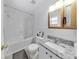 Clean bathroom with a bathtub, toilet, and granite countertop at 8106 N Rome Ave, Tampa, FL 33604