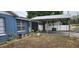 House exterior featuring a carport and walkway at 8106 N Rome Ave, Tampa, FL 33604