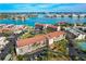 Aerial view showcasing Bridge Hampton Bay's location, building features, and parking at 8711 Blind Pass Rd # 307A, St Pete Beach, FL 33706
