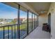 Enjoy serene water views from this bright balcony with tile floors and full hurricane protection at 8711 Blind Pass Rd # 307A, St Pete Beach, FL 33706
