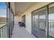 Enjoy this private balcony with two wicker chairs, sliding glass doors, and water views at 8711 Blind Pass Rd # 307A, St Pete Beach, FL 33706
