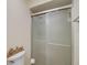 Bathroom with frosted shower doors and nautical decor at 8711 Blind Pass Rd # 307A, St Pete Beach, FL 33706