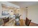 Bright dining area with glass-top table and wicker chairs, open to the kitchen at 8711 Blind Pass Rd # 307A, St Pete Beach, FL 33706