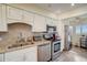 Well-equipped kitchen features stainless steel appliances, granite countertops, and ample cabinet space at 8711 Blind Pass Rd # 307A, St Pete Beach, FL 33706