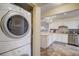 Stackable washer and dryer in a convenient laundry closet at 8711 Blind Pass Rd # 307A, St Pete Beach, FL 33706