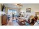 Relaxing living room with comfy seating and access to balcony at 8711 Blind Pass Rd # 307A, St Pete Beach, FL 33706