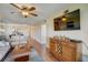 Spacious living area with hardwood floors and view into kitchen at 8711 Blind Pass Rd # 307A, St Pete Beach, FL 33706