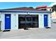 Community pool equipment building with storage and access doors at 8711 Blind Pass Rd # 307A, St Pete Beach, FL 33706