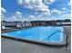 Refreshing community swimming pool with waterfront views at 8711 Blind Pass Rd # 307A, St Pete Beach, FL 33706