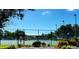 Outdoor fenced tennis courts with blue and green playing surfaces at 8711 Blind Pass Rd # 307A, St Pete Beach, FL 33706