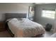 Bright bedroom with large bed and window at 8818 Bay Pointe Dr # 208, Tampa, FL 33615