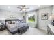 Main bedroom with stone accent wall and large window at 11393 Crescent Deer Dr, Land O Lakes, FL 34638