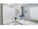 Bathroom with single vanity, granite countertop, and bathtub at 11381 Crescent Deer Dr, Land O Lakes, FL 34638