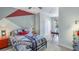 Bedroom with a red and gray accent wall, and a built-in workspace at 11381 Crescent Deer Dr, Land O Lakes, FL 34638