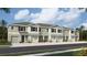 Modern 3-story townhome with attached garage and neutral color palette at 11381 Crescent Deer Dr, Land O Lakes, FL 34638