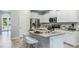 Modern kitchen with island and stainless steel appliances at 11381 Crescent Deer Dr, Land O Lakes, FL 34638