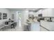 Modern kitchen with stainless steel appliances and an island with seating at 11389 Crescent Deer Dr, Land O Lakes, FL 34638