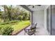 Covered lanai overlooking a lush, green backyard at 11389 Crescent Deer Dr, Land O Lakes, FL 34638