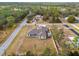 Aerial view of a house with a large backyard at 13254 Kitty Rd, Weeki Wachee, FL 34614