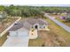 Single story house, two-car garage, boat in driveway, and fenced backyard at 13254 Kitty Rd, Weeki Wachee, FL 34614