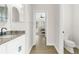 Bathroom with single vanity and access to bedroom at 13254 Kitty Rd, Weeki Wachee, FL 34614
