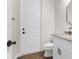 Small bathroom with white vanity, toilet, and granite countertop at 13254 Kitty Rd, Weeki Wachee, FL 34614
