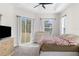Main bedroom with backyard access and a king-size bed at 13254 Kitty Rd, Weeki Wachee, FL 34614