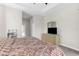 Spacious bedroom with carpeted floor and a dresser with TV at 13254 Kitty Rd, Weeki Wachee, FL 34614