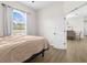 Bedroom with a view, walk-in closet, and arched window at 13254 Kitty Rd, Weeki Wachee, FL 34614