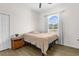 Cozy bedroom featuring a double bed and wood-look floors at 13254 Kitty Rd, Weeki Wachee, FL 34614