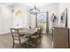 Formal dining room with a large wooden table and bench seating at 13254 Kitty Rd, Weeki Wachee, FL 34614