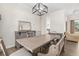 Bright dining room with a large table and bench seating, open to living area at 13254 Kitty Rd, Weeki Wachee, FL 34614