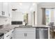 Modern kitchen with island, stainless steel appliances, and granite countertops at 13254 Kitty Rd, Weeki Wachee, FL 34614