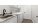 Laundry room with washer, dryer, and utility sink at 13254 Kitty Rd, Weeki Wachee, FL 34614