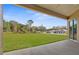 Covered patio overlooking a large backyard at 13254 Kitty Rd, Weeki Wachee, FL 34614