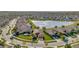 Community overview showcasing a lakefront neighborhood with numerous homes at 16340 Treasure Point Dr, Wimauma, FL 33598