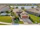 Single-Gathering home with a two-car garage and a landscaped yard, located on a quiet cul-de-sac at 16340 Treasure Point Dr, Wimauma, FL 33598