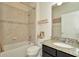 Bathroom with granite countertop, shower, and bathtub at 16340 Treasure Point Dr, Wimauma, FL 33598