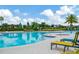 Relaxing pool area with lounge chairs at 16340 Treasure Point Dr, Wimauma, FL 33598