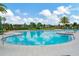 Resort-style pool with lounge chairs and a pergola at 16340 Treasure Point Dr, Wimauma, FL 33598