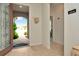 Bright and spacious entryway with view to backyard and additional rooms at 16340 Treasure Point Dr, Wimauma, FL 33598