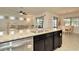 Kitchen island with sink, granite countertop, and stainless steel dishwasher at 16340 Treasure Point Dr, Wimauma, FL 33598