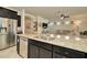 Island kitchen with granite countertops and stainless steel appliances at 16340 Treasure Point Dr, Wimauma, FL 33598