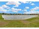 Community features a tranquil lake with waterfront homes at 16340 Treasure Point Dr, Wimauma, FL 33598