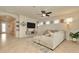 Living Room with sectional sofa and fireplace at 16340 Treasure Point Dr, Wimauma, FL 33598