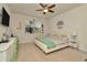 Spacious Main Bedroom with large bed and ceiling fan at 16340 Treasure Point Dr, Wimauma, FL 33598