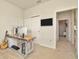 Spacious home office with a desk, computer, and ample natural light at 16340 Treasure Point Dr, Wimauma, FL 33598